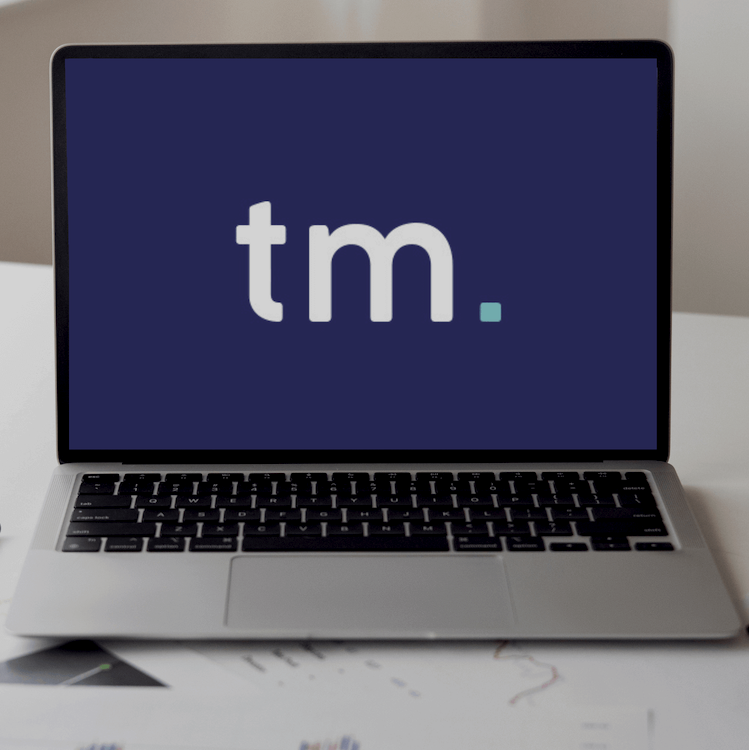 Team marketing short logo displaying on apple mac screen